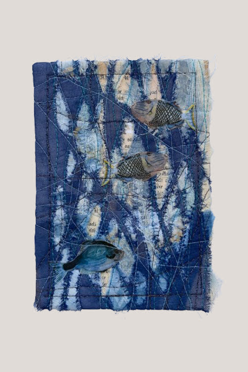 A small indigo-dyed cloth with watercolour fish and glimpsed book-page text surfacing through distressed, cut-back fabric, edges finished clean.